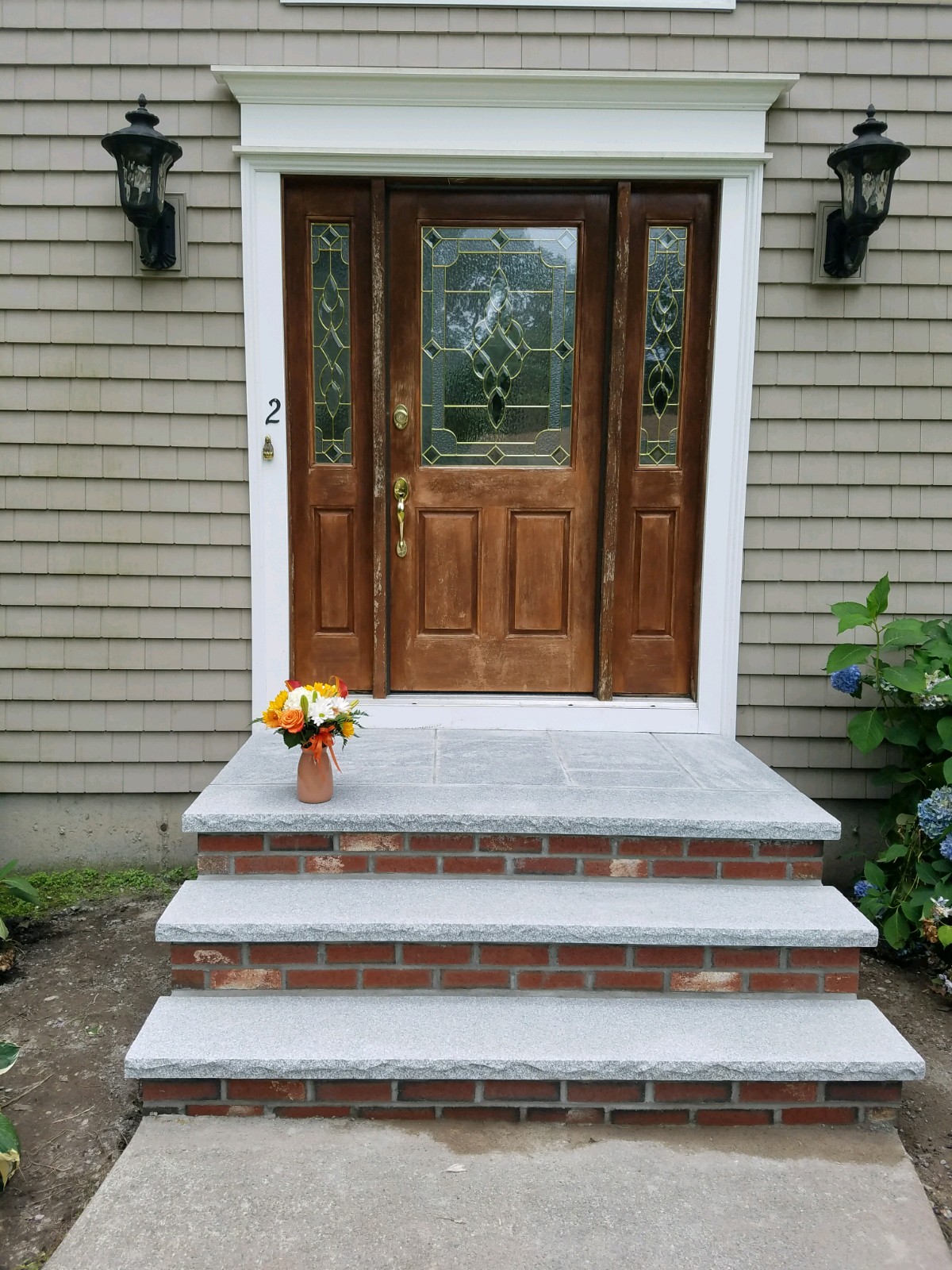 New brick and granite steps installed at a Stoughton, MA home by Mass Patio & Masonry